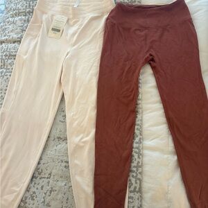 Fabletics Cream Jogger Pants and rust colored leggings